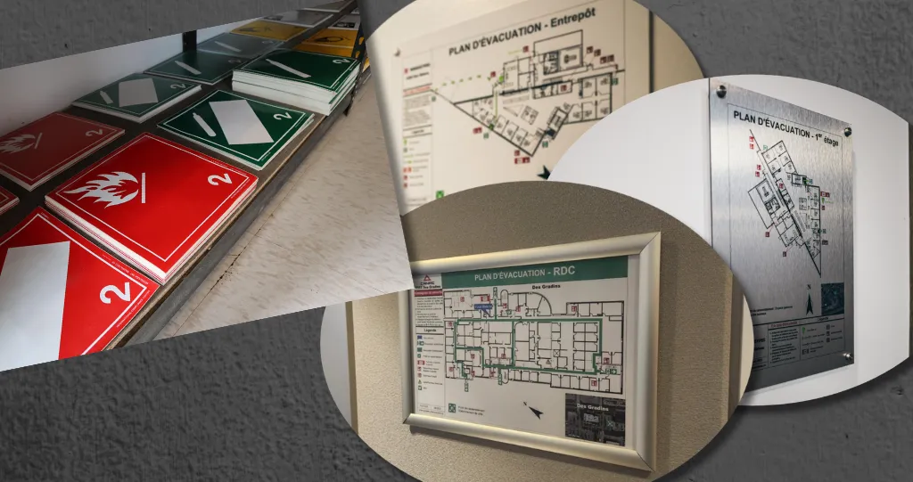 Placards de transport de matières dangereuses et plans d'évacuation affichés au mur